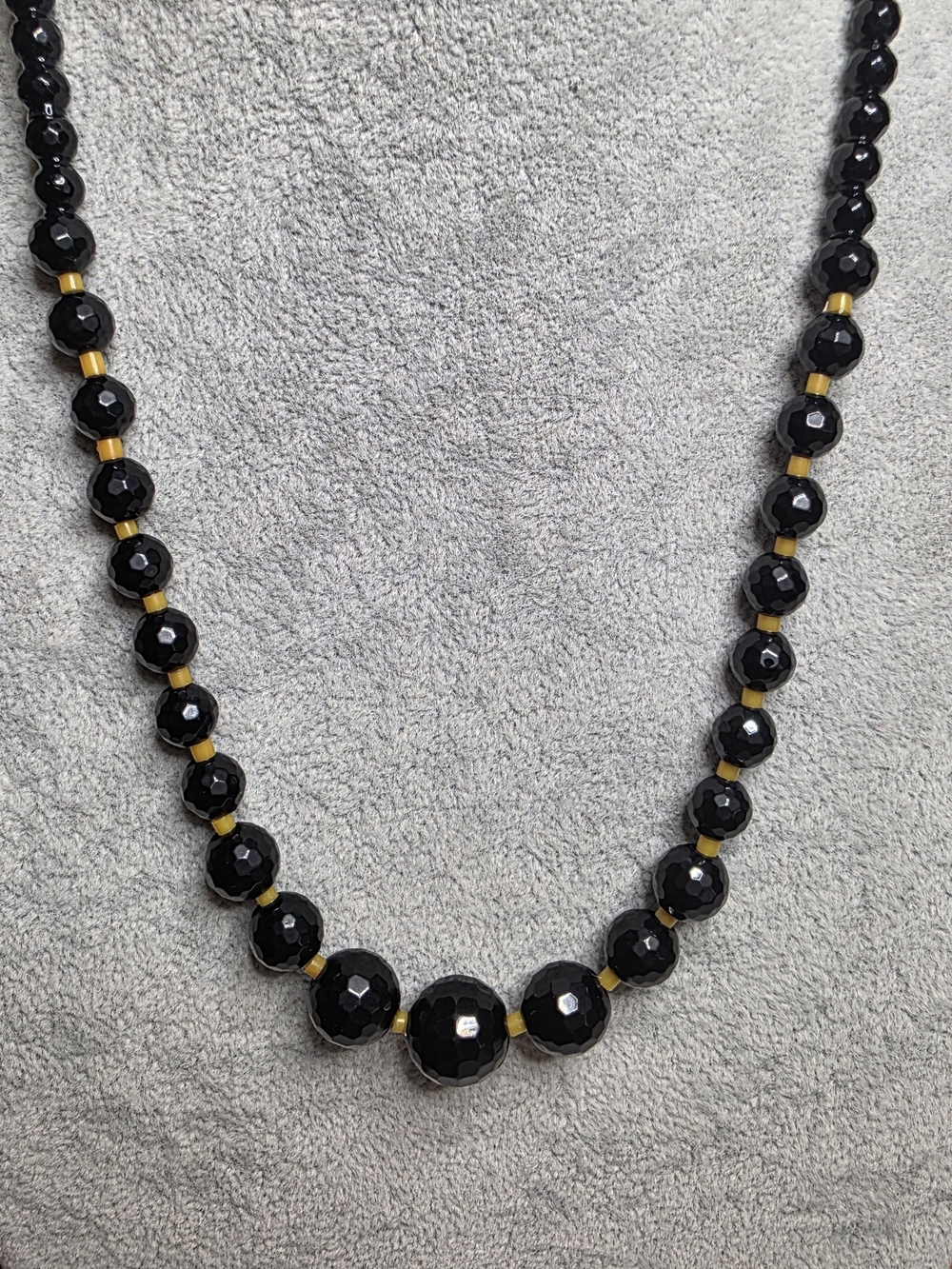 Faceted Black Glass Graduated Bead Necklace With Tan/Gold Spacer Beads